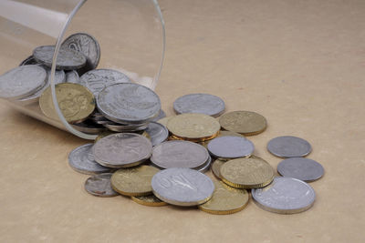 High angle view of coins on table