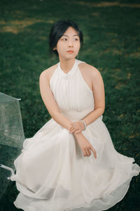 Young woman standing on field