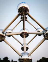 Low angle view of ferris wheel against sky