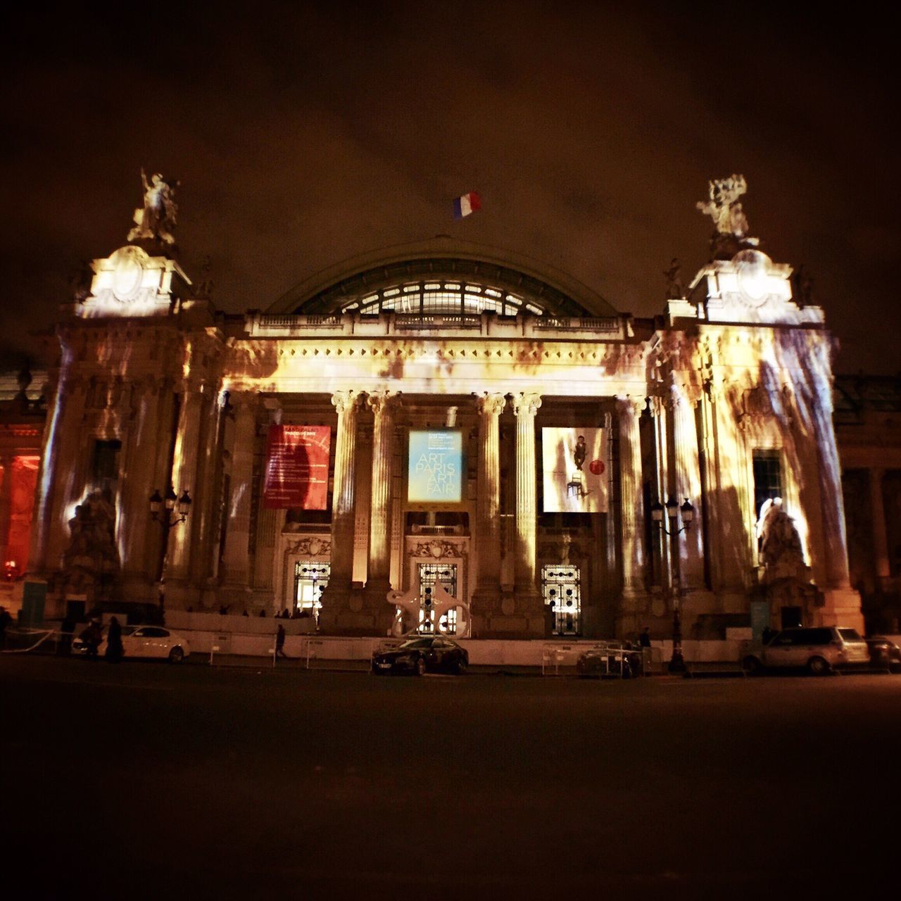 architecture, built structure, building exterior, night, architectural column, illuminated, facade, history, arch, entrance, travel destinations, old, famous place, column, outdoors, window, sky, city, low angle view, incidental people