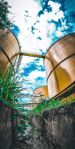 Low angle view of factory against sky