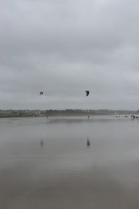 Scenic view of sea against cloudy sky