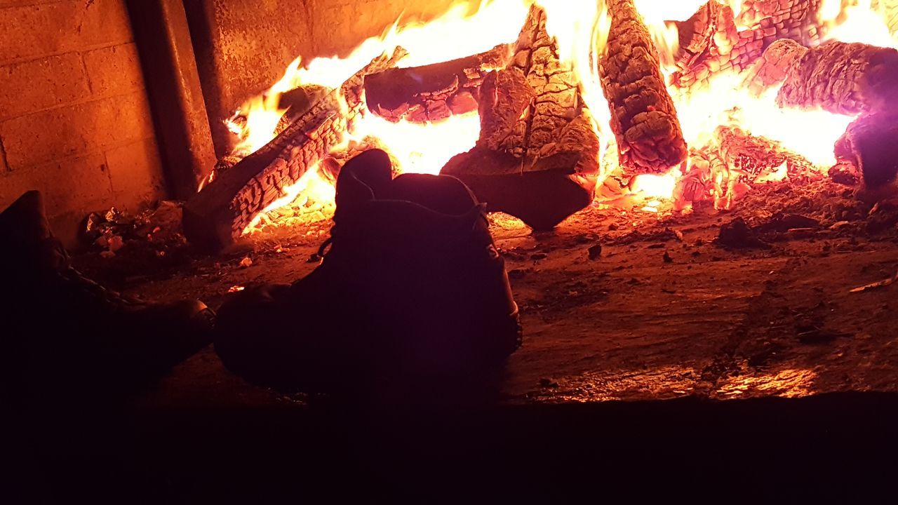 CLOSE-UP OF PERSON WITH FIRE IN DARK