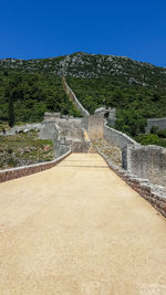 Scenic view of mountain against clear blue sky