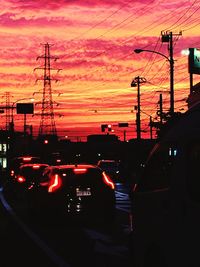 Cars on road at sunset