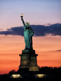 Statue of liberty against sky during sunset