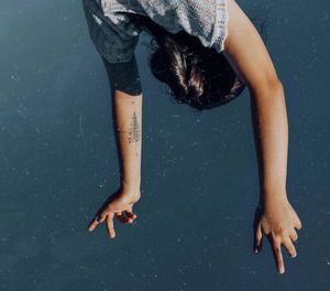 Low section of woman legs in sea