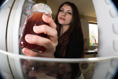 Portrait of a woman holding food