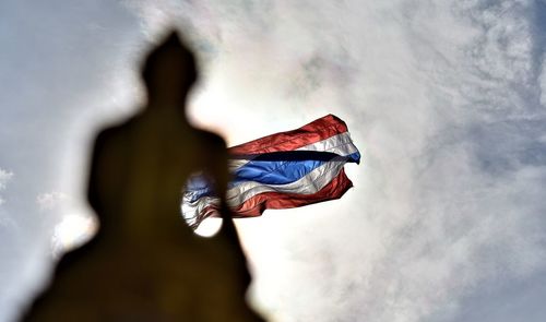 Low angle view of flag against sky