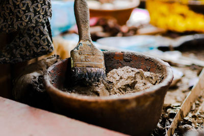 Close-up of old bread in container