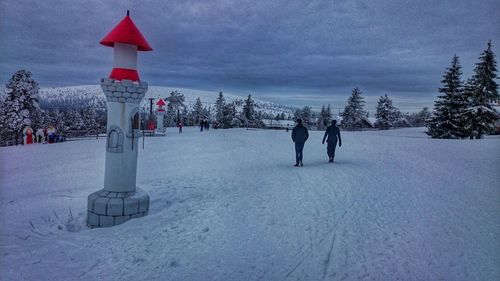 People on snow covered landscape