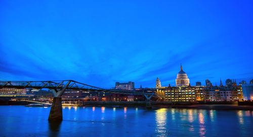 Illuminated city at waterfront