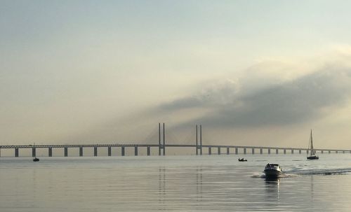 Bridge over sea against sky