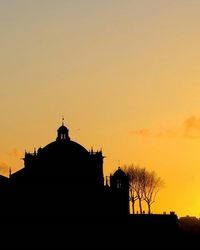 Low angle view of silhouette church against sky