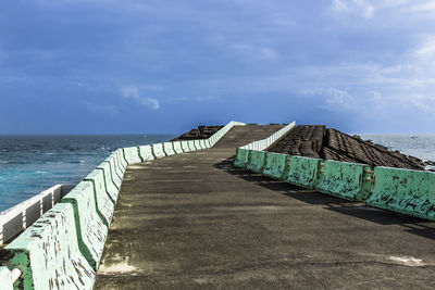 Pier over sea against sky