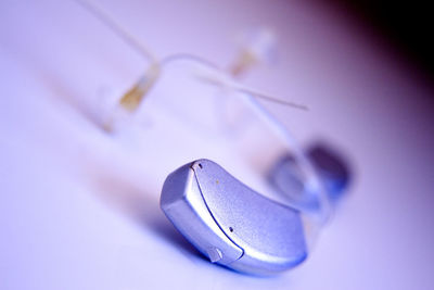 Close-up of hearing aid on table