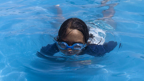 High angle view of man swimming in pool