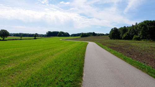 Road passing through field