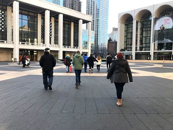 People walking on modern office building