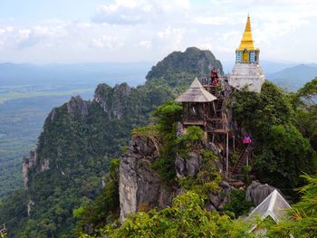 View of temple building against cloudy sky