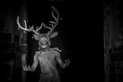 Man in deer costume performing on stage