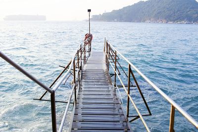 Pier over sea against sky