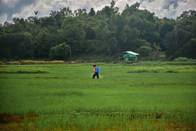 Full length of man on field