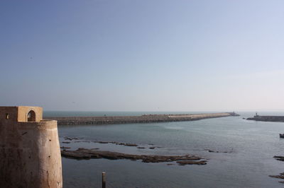 View of calm blue sea against clear sky