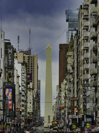 Low angle view of buildings against sky in city