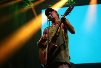 Low angle view of man playing guitar