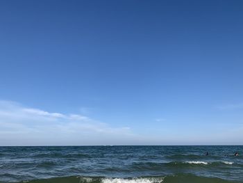 Scenic view of sea against blue sky