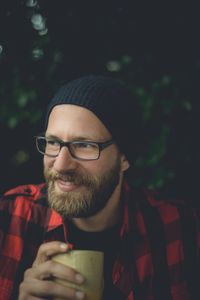 Close-up portrait of a man drinking drink