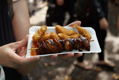 Close-up of hand holding food