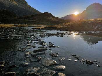 High sunrise peaks lake in vanoise national park, hautes alps, france