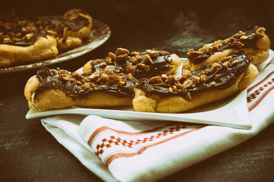 High angle view of dark chocolate hazelnut eclairs