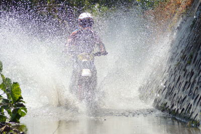 Man splashing water