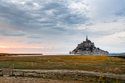 View of mont saint-michel at sunset against sky