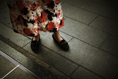 Low section of woman standing on floor