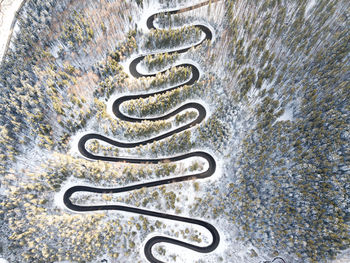 High angle view of metal grate on sea shore