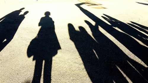 Shadow of people standing on floor