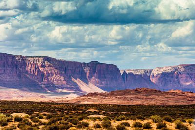 Scenic view of mountains against cloudy sky