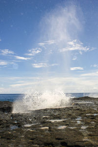 Scenic view of sea against cloudy sky