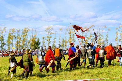 People on field against sky