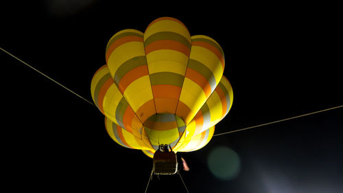 Low angle view of hot air balloon against sky at night