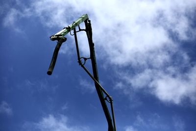 Low angle view of street light against sky