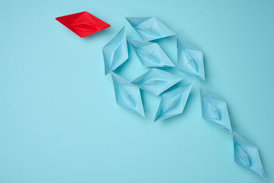 High angle view of crumpled paper on blue background