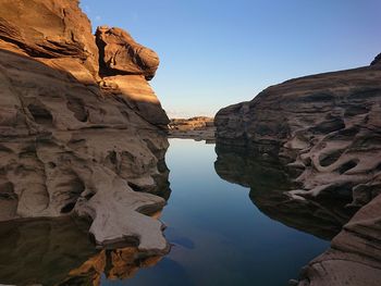 Scenic view of rock formations against sky