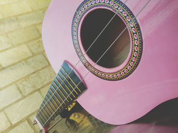 High angle view of guitar on table