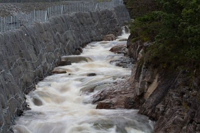 Water flowing through rocks in forest