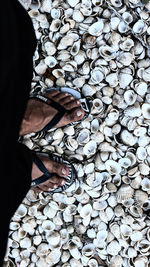 Low section of man standing on stones